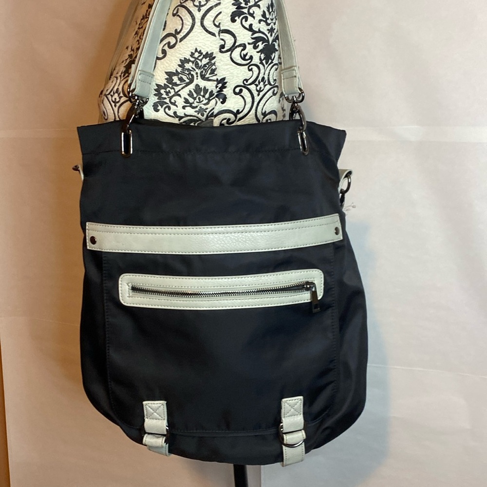 Crossbody bags one can be used as a tote. In good preowned condition.